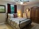 Comfortable bedroom with a ceiling fan, and an armoire, providing a private retreat at 3474 Leaf Land Ct, Duluth, GA 30097