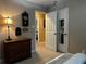 The bedroom features neutral carpet, a dark wood dresser, and an ornate hanging clock at 3474 Leaf Land Ct, Duluth, GA 30097