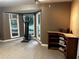 Bright bonus room with tiled floors and large windows overlooking the property and a corner shelf and game storage at 3474 Leaf Land Ct, Duluth, GA 30097