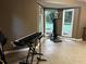 Bright bonus room with tiled floors, large windows overlooking the yard, and space for fitness equipment at 3474 Leaf Land Ct, Duluth, GA 30097