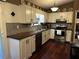 Bright kitchen with white cabinets, modern appliances, and warm wood countertops at 3474 Leaf Land Ct, Duluth, GA 30097