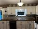Updated kitchen with white cabinets, wood countertops, and stainless steel sink at 3474 Leaf Land Ct, Duluth, GA 30097