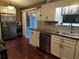 Modern kitchen featuring stainless steel appliances, sleek cabinets, and wood countertops at 3474 Leaf Land Ct, Duluth, GA 30097