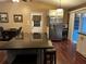 Modern kitchen with stainless steel appliances, wood countertops, and a convenient breakfast bar at 3474 Leaf Land Ct, Duluth, GA 30097