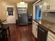 Modern kitchen with stainless steel appliances, wood countertops, and a convenient breakfast bar at 3474 Leaf Land Ct, Duluth, GA 30097