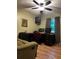 The office space has a large desk, comfortable chair, and neutral laminate flooring at 3474 Leaf Land Ct, Duluth, GA 30097