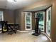 Multipurpose room with bay windows, tile floors, and ample natural light at 3474 Leaf Land Ct, Duluth, GA 30097