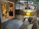 Relaxing screened-in porch featuring a comfortable couch with views of the home's exterior and an adjacent bedroom at 3474 Leaf Land Ct, Duluth, GA 30097