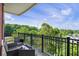 Relaxing balcony with seating area and a lush green treetop view at 3820 Roswell Ne Rd # 510, Atlanta, GA 30342