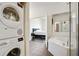 Bright bathroom with a stackable washer-dryer and separate tub and shower at 3820 Roswell Ne Rd # 510, Atlanta, GA 30342