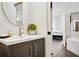 Bathroom with a modern sink vanity adjacent to a bedroom and bathroom with a tub at 3820 Roswell Ne Rd # 510, Atlanta, GA 30342
