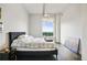 Cozy bedroom featuring a modern light fixture and a window with a view at 3820 Roswell Ne Rd # 510, Atlanta, GA 30342