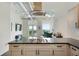 The kitchen features modern appliances, an island cooktop, and an open living area with a balcony at 3820 Roswell Ne Rd # 510, Atlanta, GA 30342