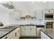 Modern kitchen featuring stainless steel appliances, granite countertops, and sleek cabinetry for a sophisticated look at 3820 Roswell Ne Rd # 510, Atlanta, GA 30342