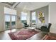 Spacious living room with balcony access, modern lighting, comfortable seating, and large windows providing natural light at 3820 Roswell Ne Rd # 510, Atlanta, GA 30342