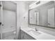 Modern bathroom featuring tile floors, granite countertop vanity and new fixtures at 7025 Bavarian Wood Pl, Buford, GA 30518