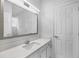 Bright bathroom featuring a large mirror, white fixtures, and natural light at 7025 Bavarian Wood Pl, Buford, GA 30518