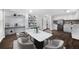 Dining room with built-in shelves features modern decor and a marble table at 7025 Bavarian Wood Pl, Buford, GA 30518