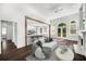 Open floor plan includes a cozy living room with a fireplace and hardwood floors at 7025 Bavarian Wood Pl, Buford, GA 30518