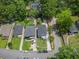A home and the surrounding lush landscape are showcased from an aerial view on a sunny day at 1603 Ezra Church Nw Dr, Atlanta, GA 30314