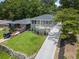 A well-maintained home and lush lawn are showcased from an aerial perspective on a sunny day at 1603 Ezra Church Nw Dr, Atlanta, GA 30314