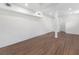 Finished basement with hardwood floors, white walls, and recessed lighting, perfect for a living or recreational space at 1603 Ezra Church Nw Dr, Atlanta, GA 30314