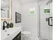 Bathroom featuring marble tile and glass enclosed shower at 1603 Ezra Church Nw Dr, Atlanta, GA 30314