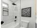 Bathroom boasts white subway tile, black fixtures and modern design at 1603 Ezra Church Nw Dr, Atlanta, GA 30314