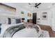 A modern style bedroom featuring a ceiling fan, natural light, ensuite, and modern decor at 1603 Ezra Church Nw Dr, Atlanta, GA 30314