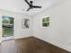 Bedroom featuring hardwood floors, neutral walls, and an open patio at 1603 Ezra Church Nw Dr, Atlanta, GA 30314