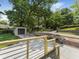 Newly installed driveway with a detached garage, complemented by stylish wood and metal railings at 1603 Ezra Church Nw Dr, Atlanta, GA 30314