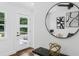 Bright entryway with a modern door, a round mirror, and stylish decor, creating a welcoming atmosphere at 1603 Ezra Church Nw Dr, Atlanta, GA 30314