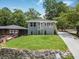 Charming home with a new lawn and a well-manicured yard situated on a sunny, green lot at 1603 Ezra Church Nw Dr, Atlanta, GA 30314
