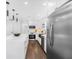 Kitchen with stainless appliances, white cabinets, island, and modern pendant lighting at 1603 Ezra Church Nw Dr, Atlanta, GA 30314