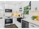 Beautiful updated kitchen with white cabinetry, granite countertops and stainless steel appliances at 1603 Ezra Church Nw Dr, Atlanta, GA 30314