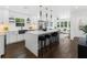 Open concept kitchen with an island, pendant lights, stainless steel appliances, and bar stool seating at 1603 Ezra Church Nw Dr, Atlanta, GA 30314