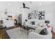 Open-concept living room featuring recessed lighting, hardwood floors, and views of the modern kitchen at 1603 Ezra Church Nw Dr, Atlanta, GA 30314
