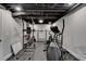 Unfinished basement, with exercise equipment, and ample space to create an additional living area at 1882 Flowering Dr, Grayson, GA 30017