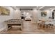 Basement with a foosball table, dining table, and barn doors to the bedroom at 1882 Flowering Dr, Grayson, GA 30017