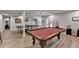 Large finished basement featuring a pool table, ping pong table, and hardwood floors at 1882 Flowering Dr, Grayson, GA 30017