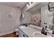 Charming bathroom with double vanity and pretty floral shower curtain at 1882 Flowering Dr, Grayson, GA 30017