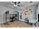 Trendy bedroom featuring a lofted bed and stylish, decorative walls at 1882 Flowering Dr, Grayson, GA 30017