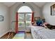 Bedroom with arched window, colorful decor, and inviting atmosphere at 1882 Flowering Dr, Grayson, GA 30017