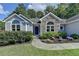 Inviting entrance with landscaped walkway leading to the front door at 1882 Flowering Dr, Grayson, GA 30017