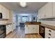 Bright kitchen featuring granite countertops, stainless steel appliances, and an adjacent dining area at 1882 Flowering Dr, Grayson, GA 30017