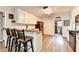 Kitchen featuring a breakfast bar, white cabinetry and stainless steel appliances at 1882 Flowering Dr, Grayson, GA 30017