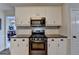 Well-equipped kitchen boasting stainless steel appliances, granite counters, and ample cabinet space at 1882 Flowering Dr, Grayson, GA 30017