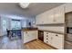 Bright kitchen with white cabinetry, granite countertops, and stainless steel appliances at 1882 Flowering Dr, Grayson, GA 30017
