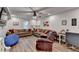 Open living room with comfortable seating, including couches and an accent chair at 1882 Flowering Dr, Grayson, GA 30017
