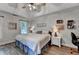 Relaxing main bedroom featuring tray ceilings, neutral decor, and abundant natural light at 1882 Flowering Dr, Grayson, GA 30017